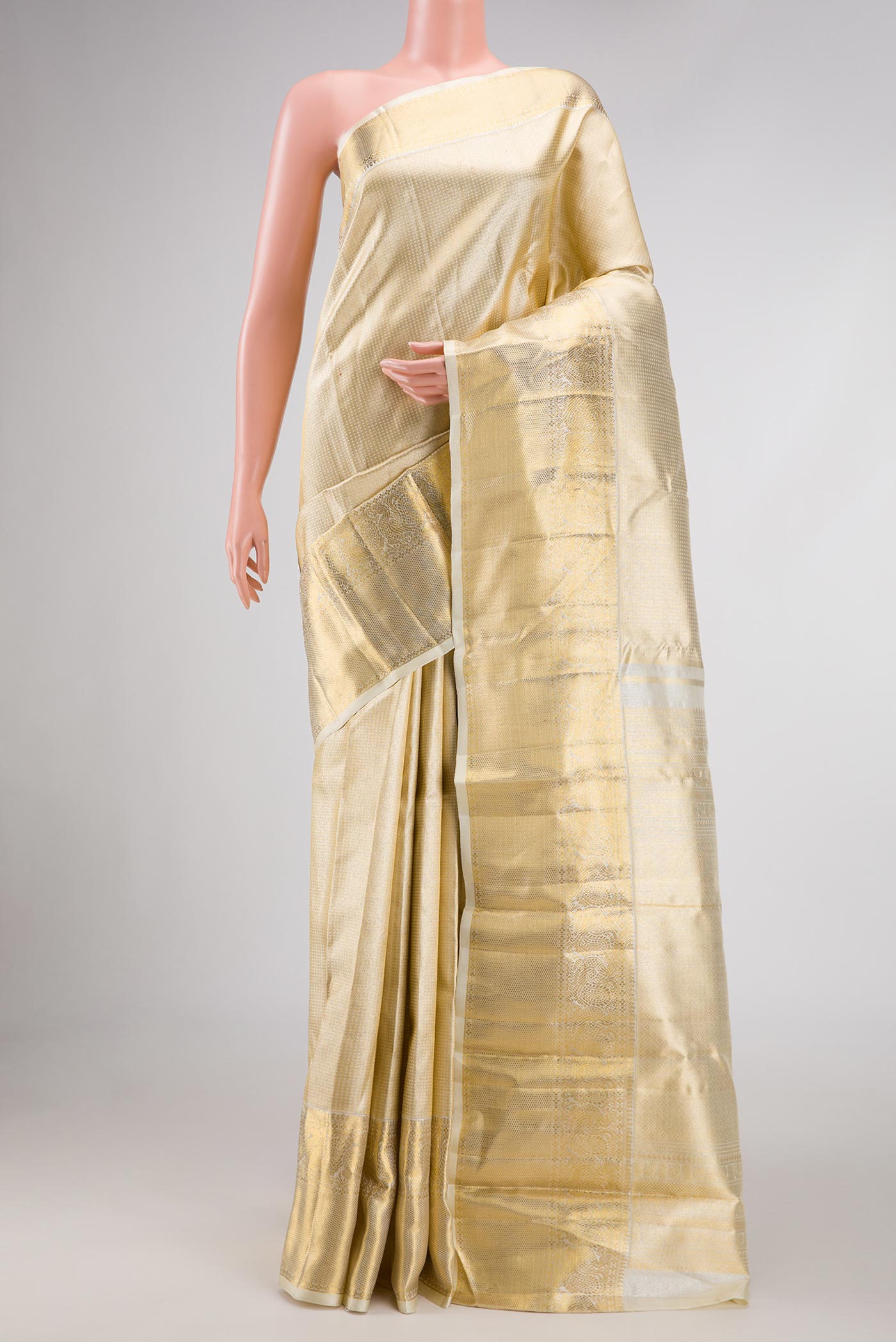 Pure Silk Pure Zari Gold Dual Tone Kanchipuram Saree with Zari Brocade on the body and Zari Border displayed on a mannequin