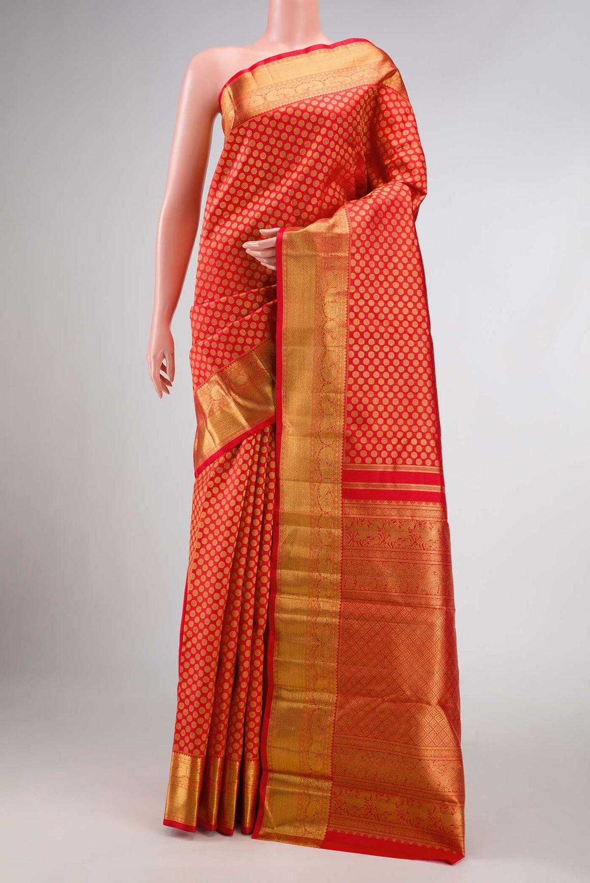 Pure Silk Pure Zari Red Dual Tone Kanchipuram Saree with Zari Brocade on the body and Zari Border displayed on a mannequin
