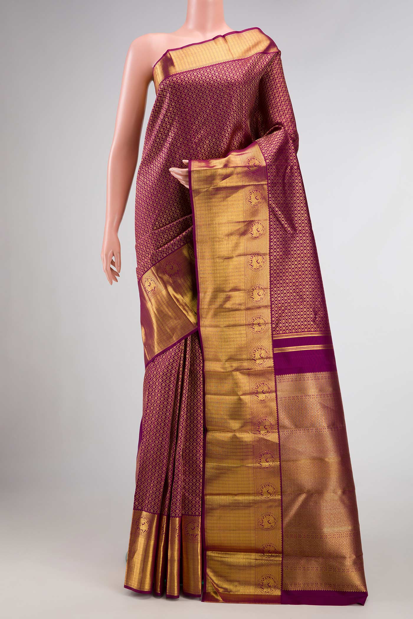 Pure Silk Pure Zari Purple Dual Tone Kanjivaram Tissue Saree with Zari Brocade on the body and Zari Border.  displayed on a mannequin