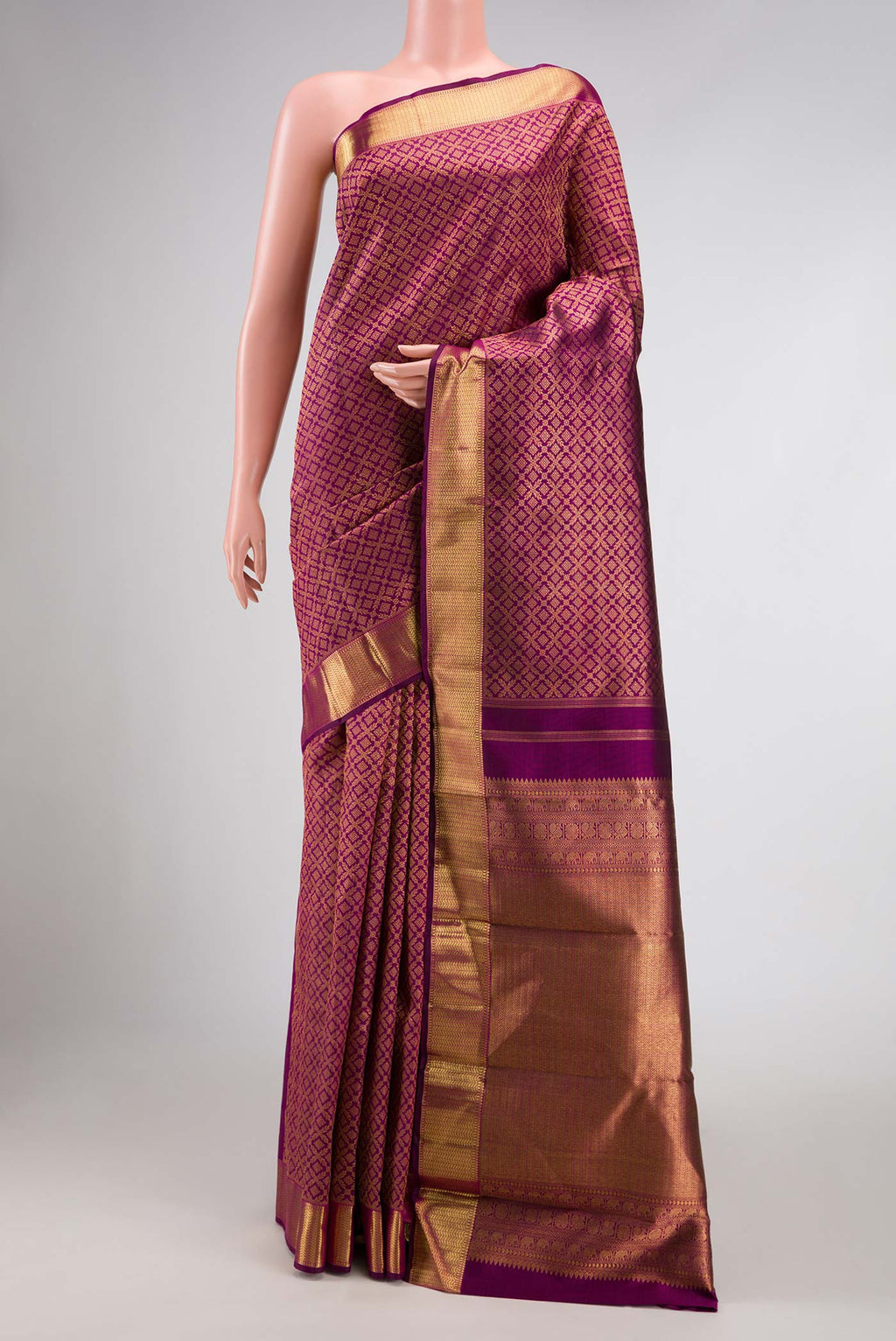 Magenta Dual Tone Kanchipuram Silk Saree with Zari Brocade on the body and Zari Border displayed on a mannequin
