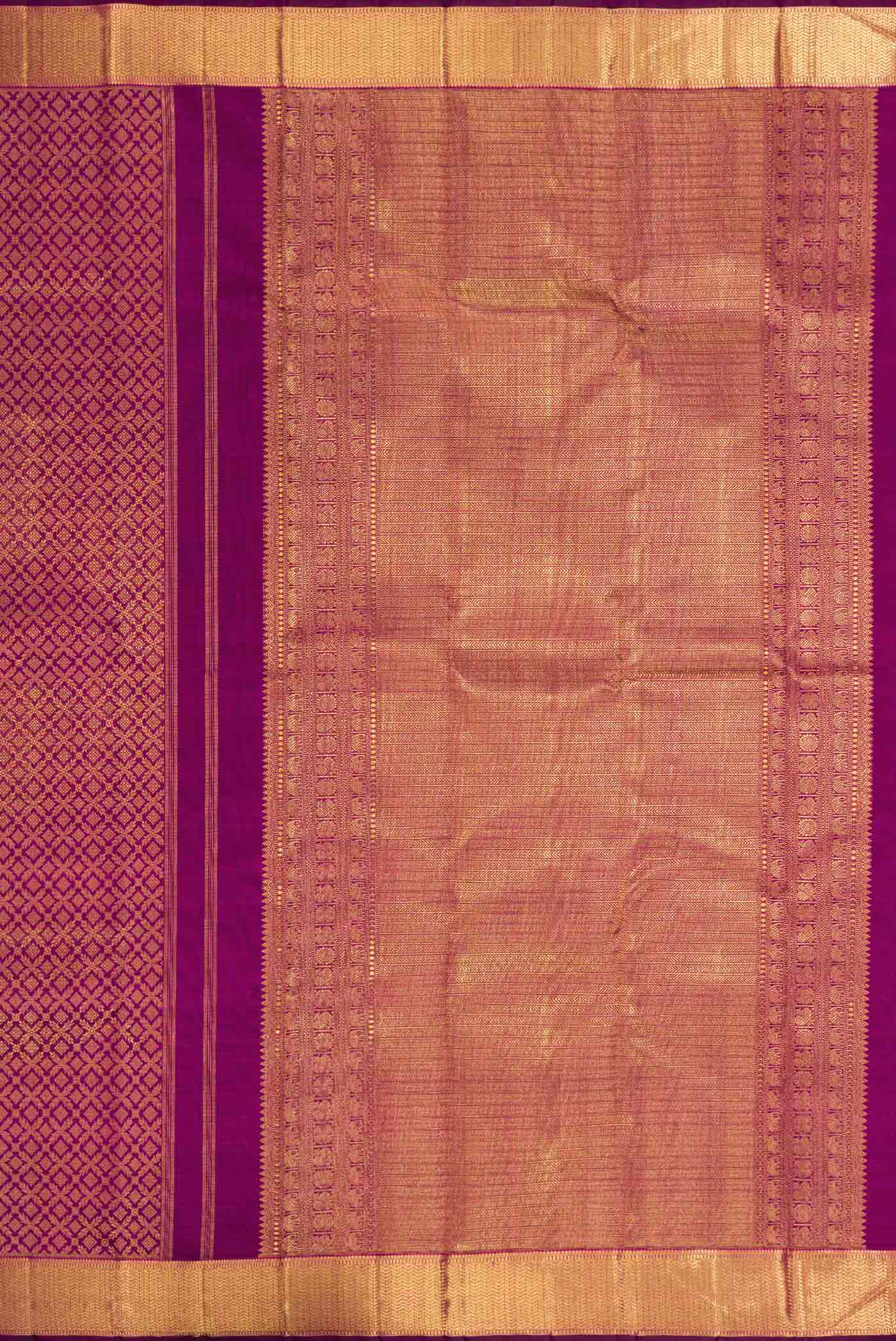 Close up image of the pallu of Magenta Dual Tone Kanchipuram Silk Saree with Zari Brocade on the body and Zari Border