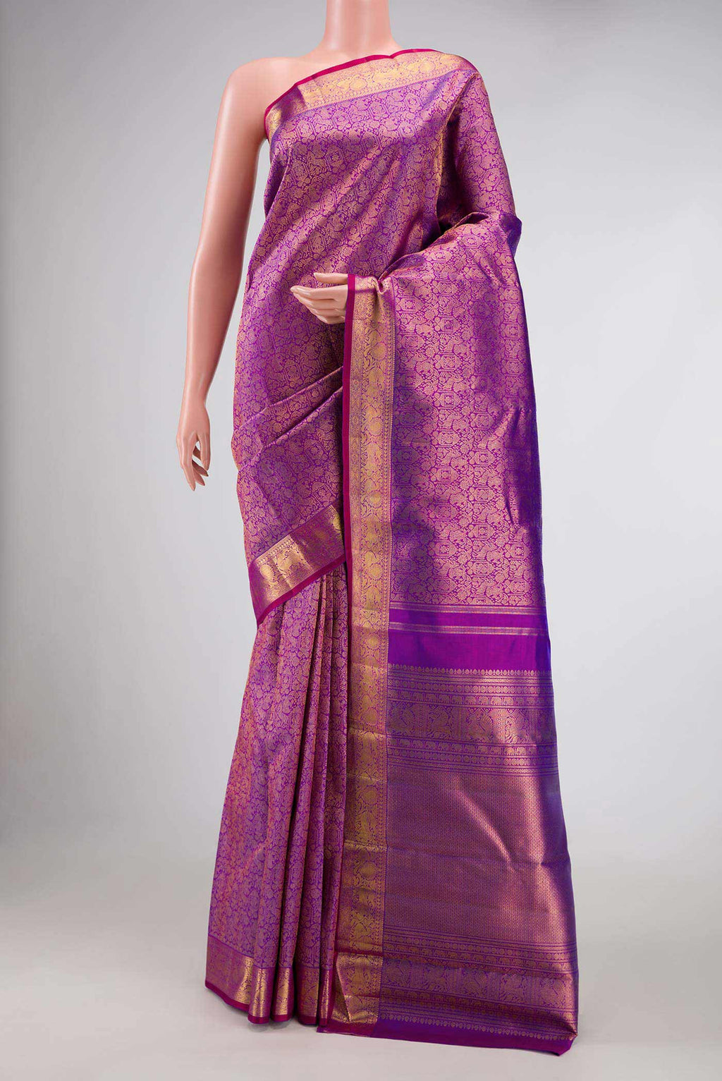 Pure Silk Pure Zari Purple Kanchipuram Saree with Zari Brocade on the body and Zari Border displayed on a mannequin