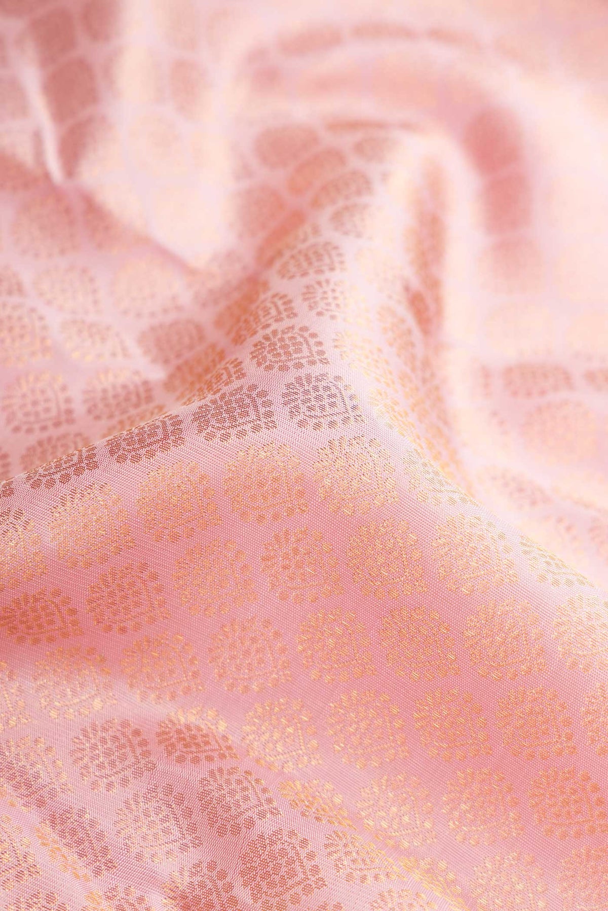 Close up of Pure Silk Pure Zari Pink Dual Tone Kanchipuram Saree with Zari Brocade on the body and Zari Border displaying folds