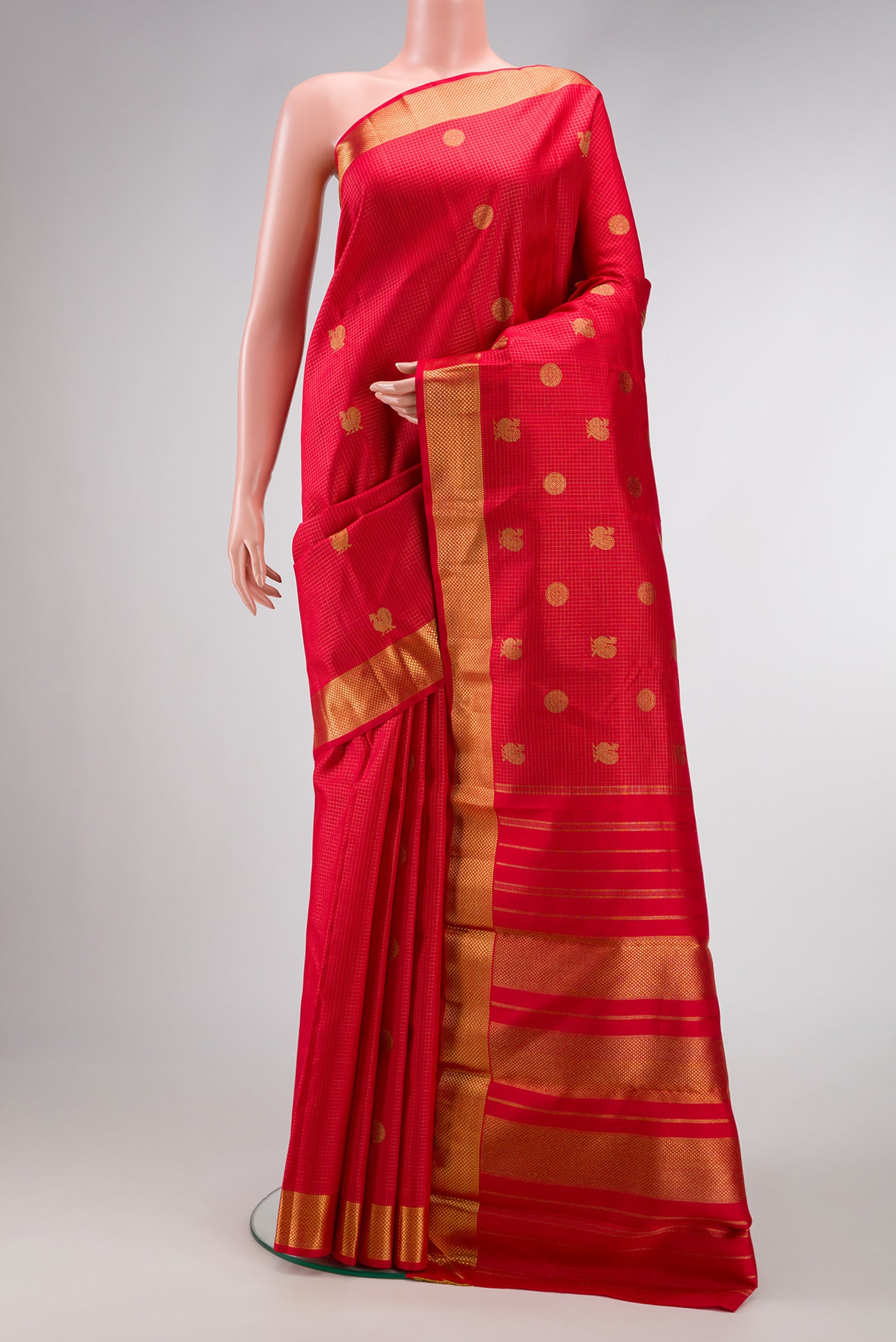 Pure Silk Pure Zari Dark Pink Dual Tone Kanjivaram Saree with Zari Butta on the body and Zari Border.  displayed on a mannequin