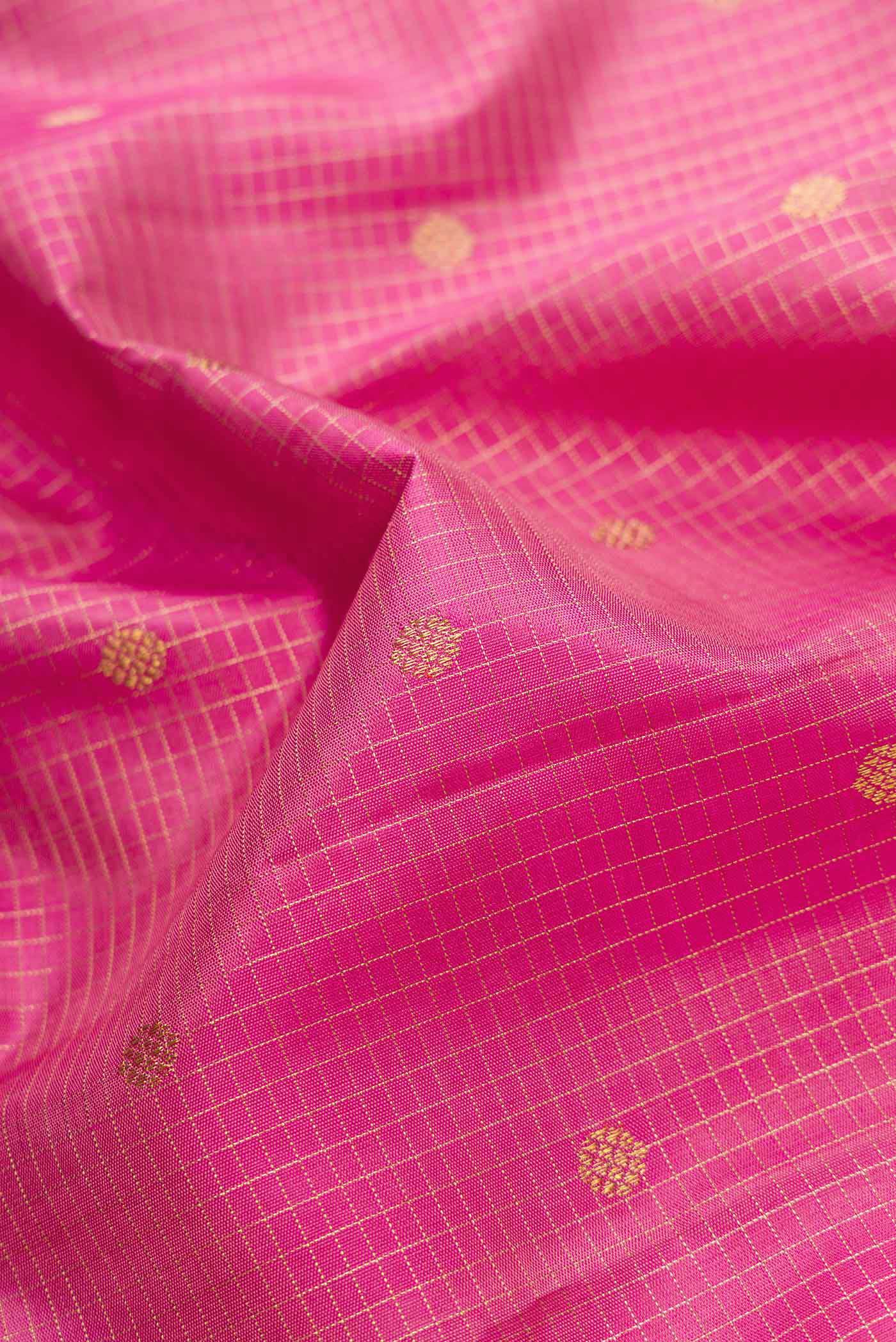 Close up of Pure Silk Pure Zari Pink Dual Tone Kanjivaram Saree with Checked design on the body and Zari Border.  displaying folds