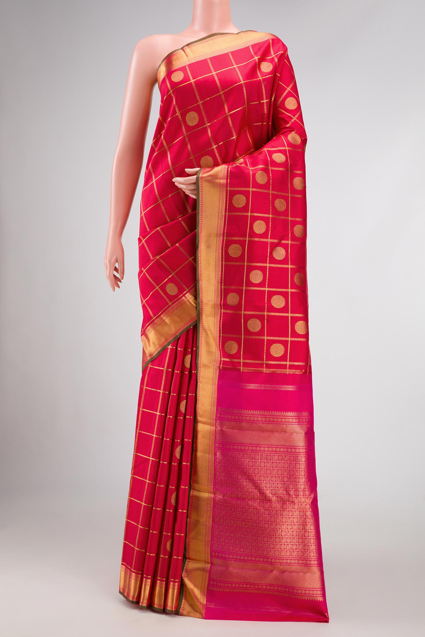Pure Silk Pure Zari Red Dual Tone Kanjivaram Saree with Checked design on the body and Zari Border.  displayed on a mannequin