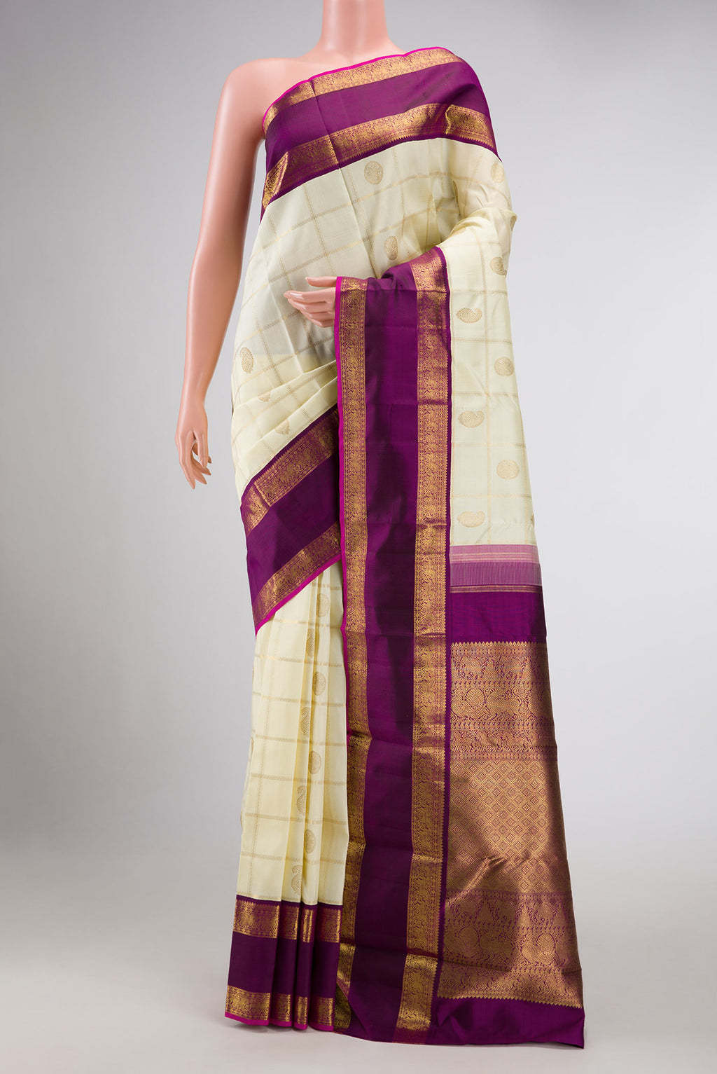 Pure Silk Pure Zari Sandal Dual Tone Kanchipuram Saree with Checked design on the body and Zari Border displayed on a mannequin