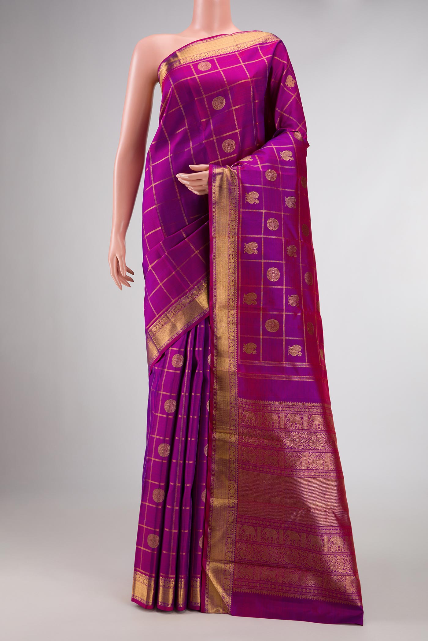 Pure Silk Pure Zari Purple Dual Tone Kanchipuram Saree with Checked design on the body and Zari Border displayed on a mannequin