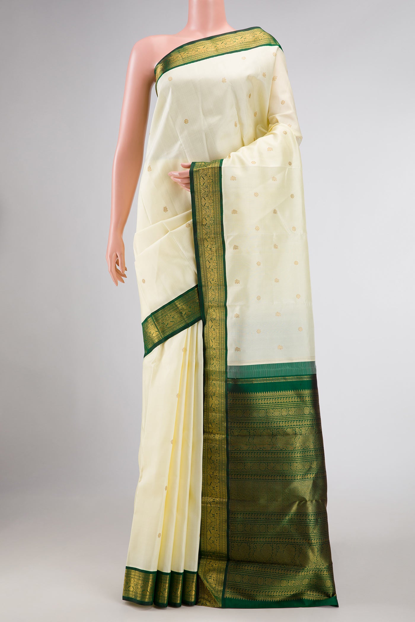 Sandal Dual Tone Kanchipuram Silk Saree with Zari Butta on the body and Zari Border displayed on a mannequin