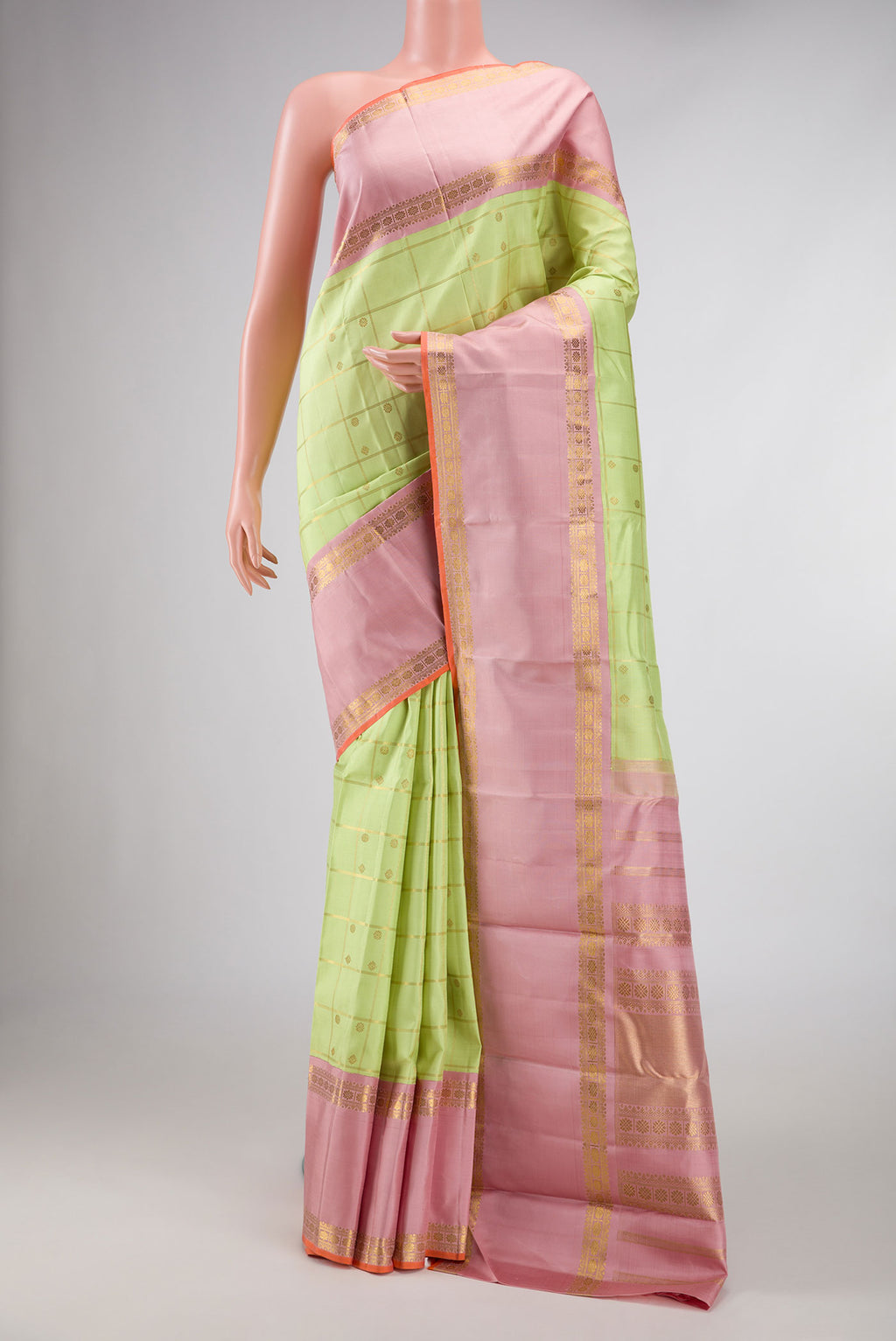 Pure Silk Pure Zari Parrot Green Dual Tone Kanchipuram Saree with Checked design on the body and Zari Border displayed on a mannequin