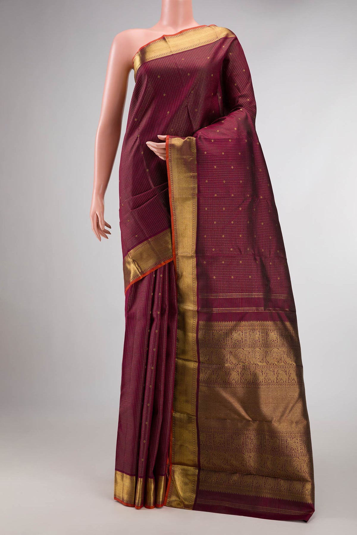 Pure Silk Pure Zari Maroon Dual Tone Kanchipuram Saree with Zari Butta on the body and Zari Border displayed on a mannequin