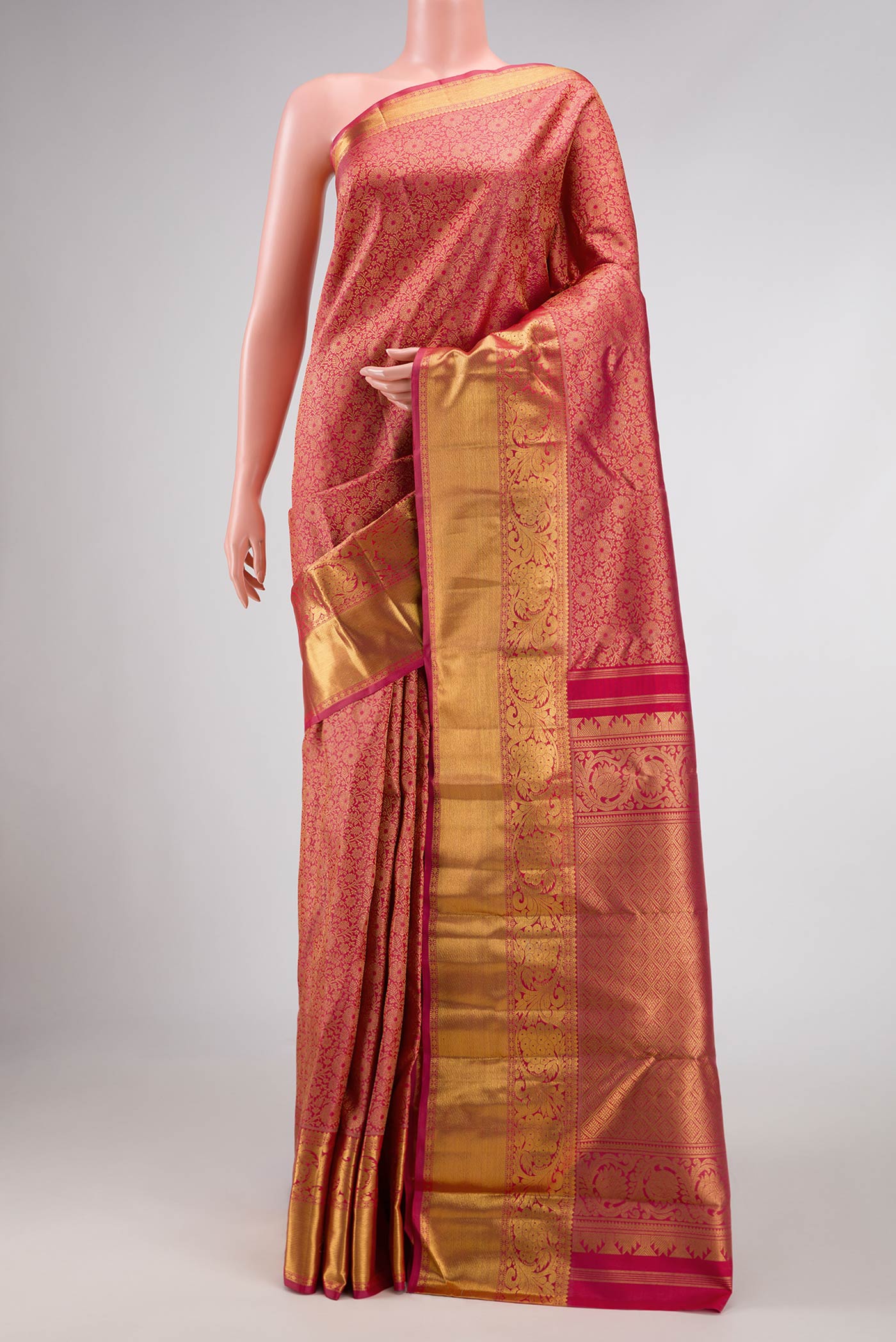 Pure Silk Pure Zari Pink Kanchipuram Saree with Zari Brocade on the body and Zari Border displayed on a mannequin