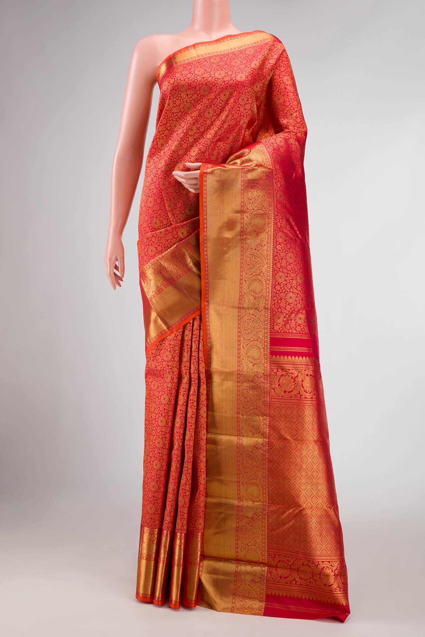 Pure Silk Pure Zari Red Dual Tone Kanchipuram Saree with Zari Brocade on the body and Zari Border displayed on a mannequin