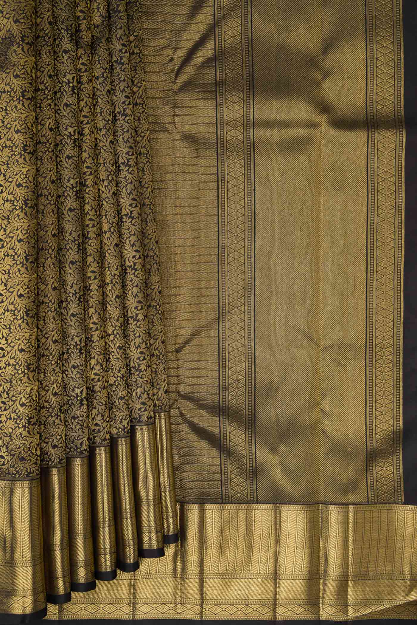 Pleats and pallu of Pure Silk Pure Zari Black Dual Tone Kanjivaram Tissue Saree with Zari Brocade on the body and Zari Border. 