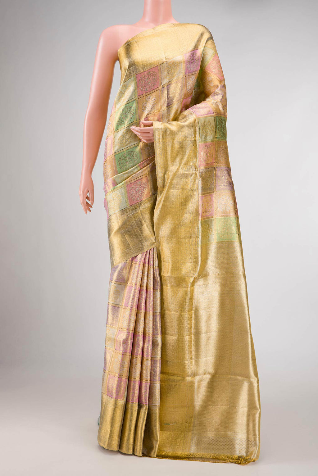 Gold, Sea Green, Pink and Purple Color Kanjivaram Tissue Silk Saree with Zari Brocade on the body and Zari Border.  displayed on a mannequin