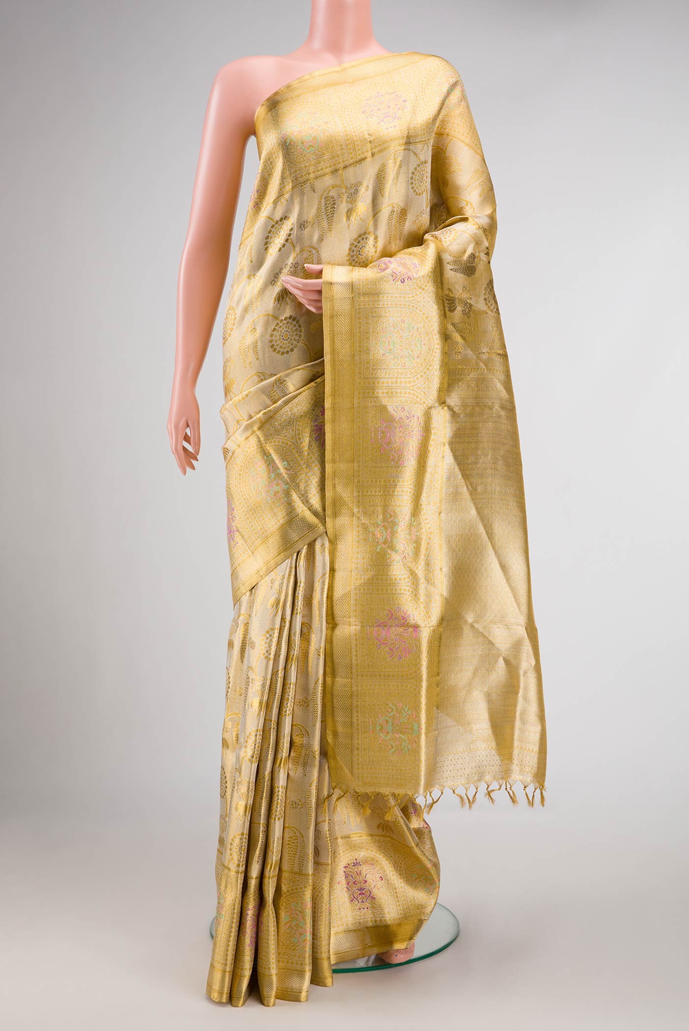 Gold Dual Tone Kanjivaram Tissue Silk Saree with Zari Brocade on the body and Fancy Border.  displayed on a mannequin