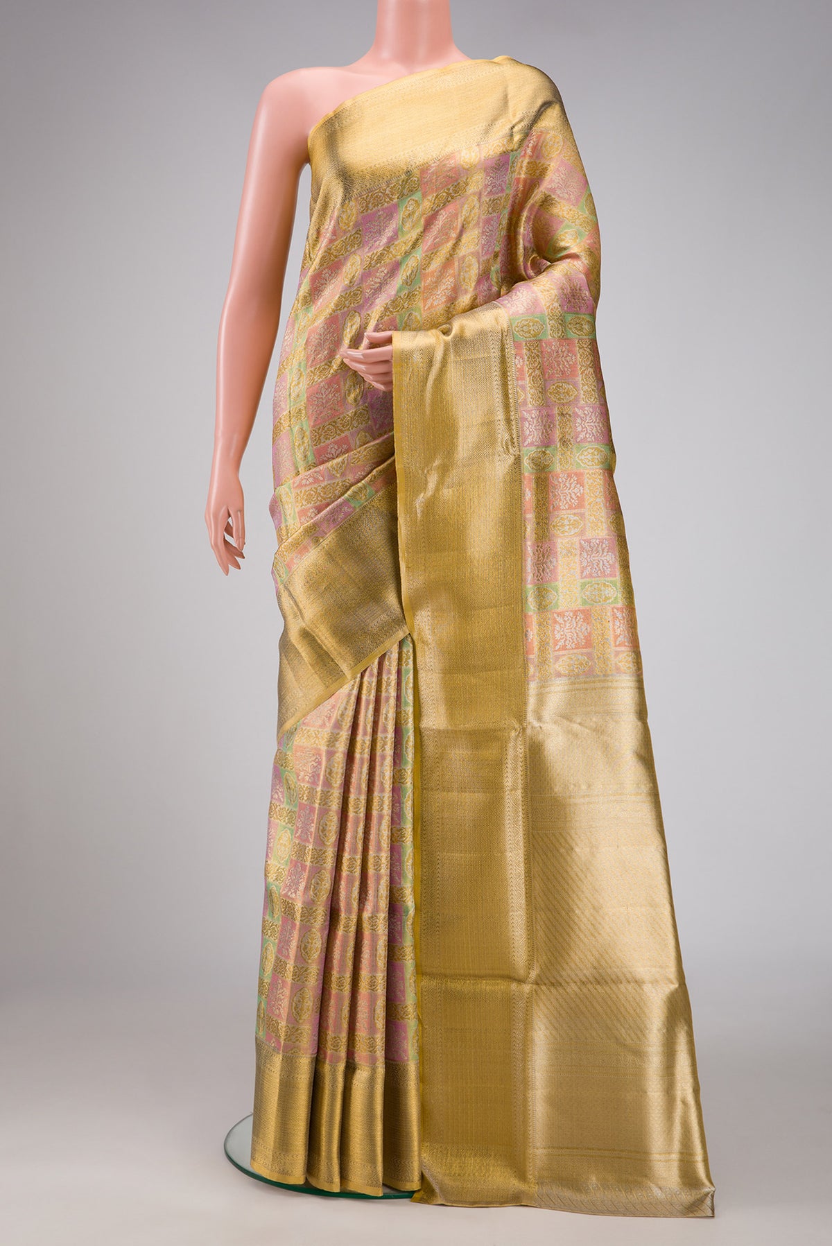 Pista Green Dual Tone Kanjivaram Tissue Silk Saree with Zari Brocade on the body and Zari Border.  displayed on a mannequin