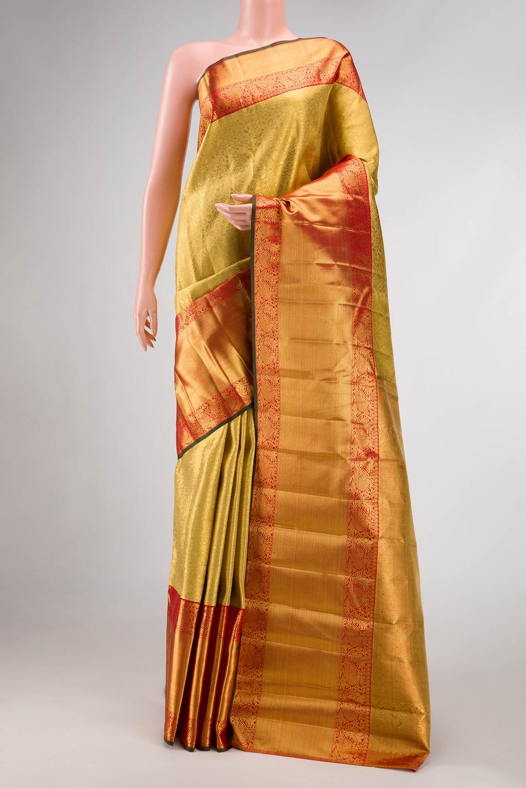 Pure Silk Pure Zari Gold Dual Tone Kanjivaram Tissue Saree with Zari Brocade on the body and Zari Border.  displayed on a mannequin