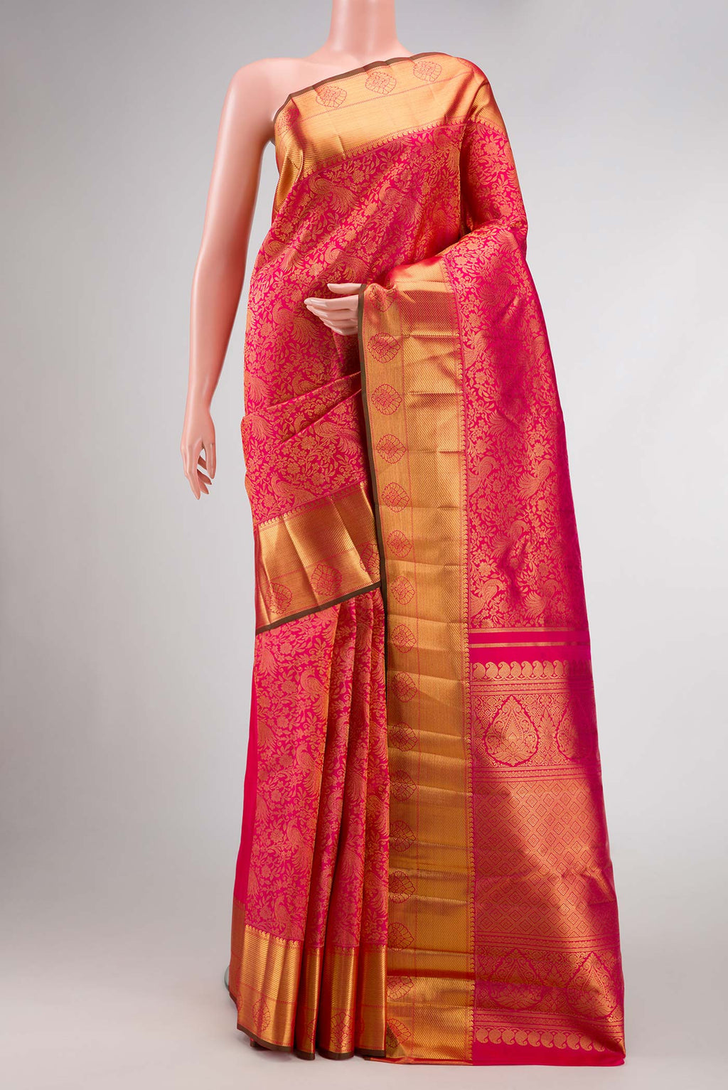 Pure Silk Pure Zari Pink Dual Tone Kanjivaram Saree with Zari Brocade on the body and Zari Border.  displayed on a mannequin