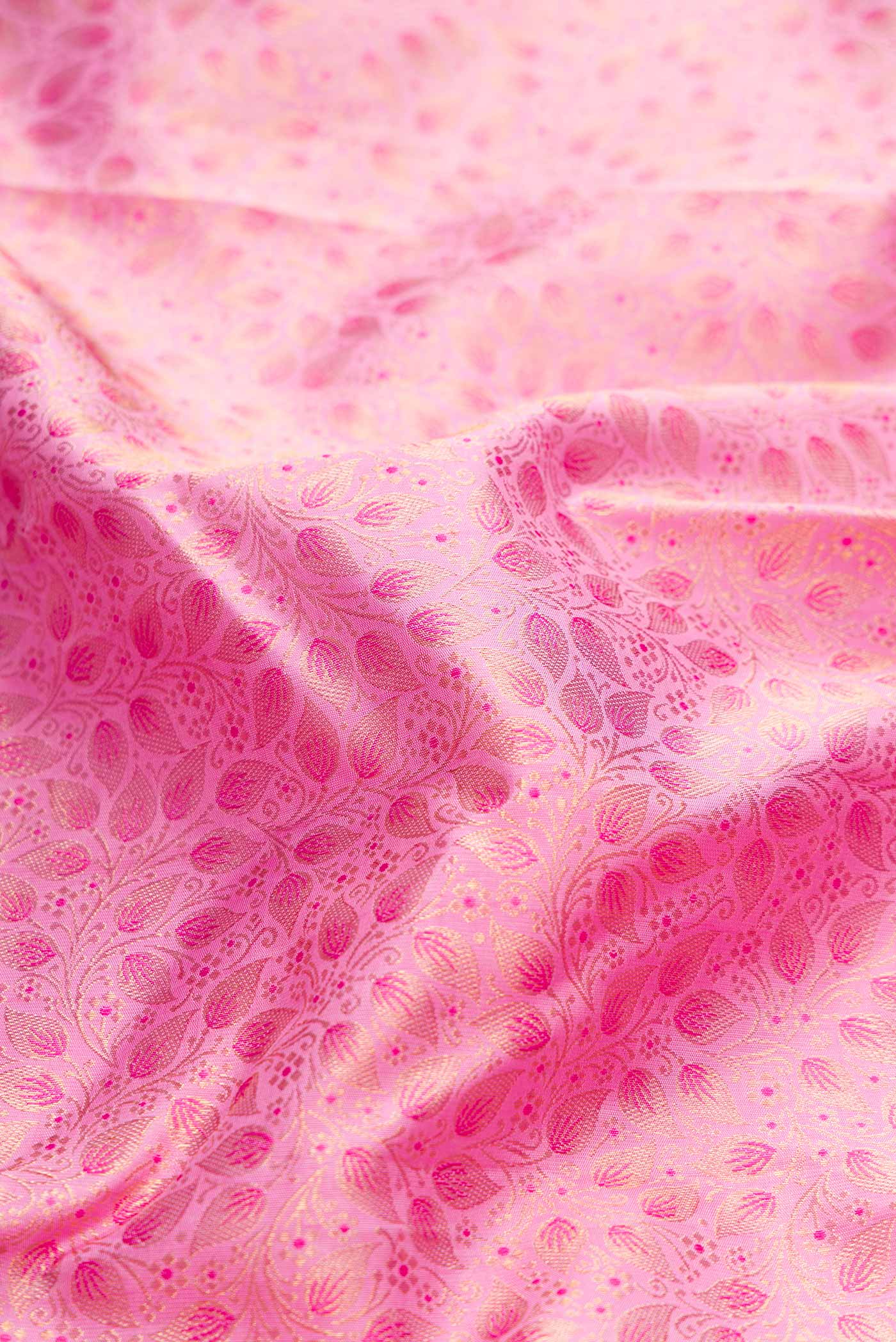 Close up of Pure Silk Pure Zari Pink Dual Tone Kanchipuram Saree with Zari Brocade on the body and Zari Border displaying folds