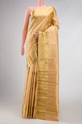 Pure Silk Pure Zari Golden Peach Dual Tone Kanchipuram Saree with Zari Brocade on the body and Zari Border displayed on a mannequin