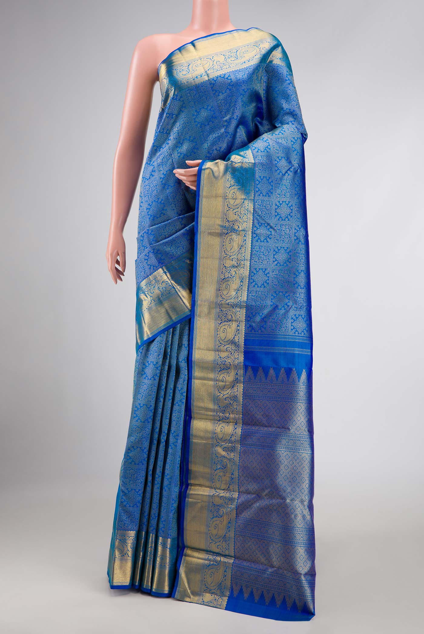 Pure Silk Pure Zari Peacock Blue Dual Tone Kanchipuram Saree with Zari Brocade on the body and Zari Border displayed on a mannequin
