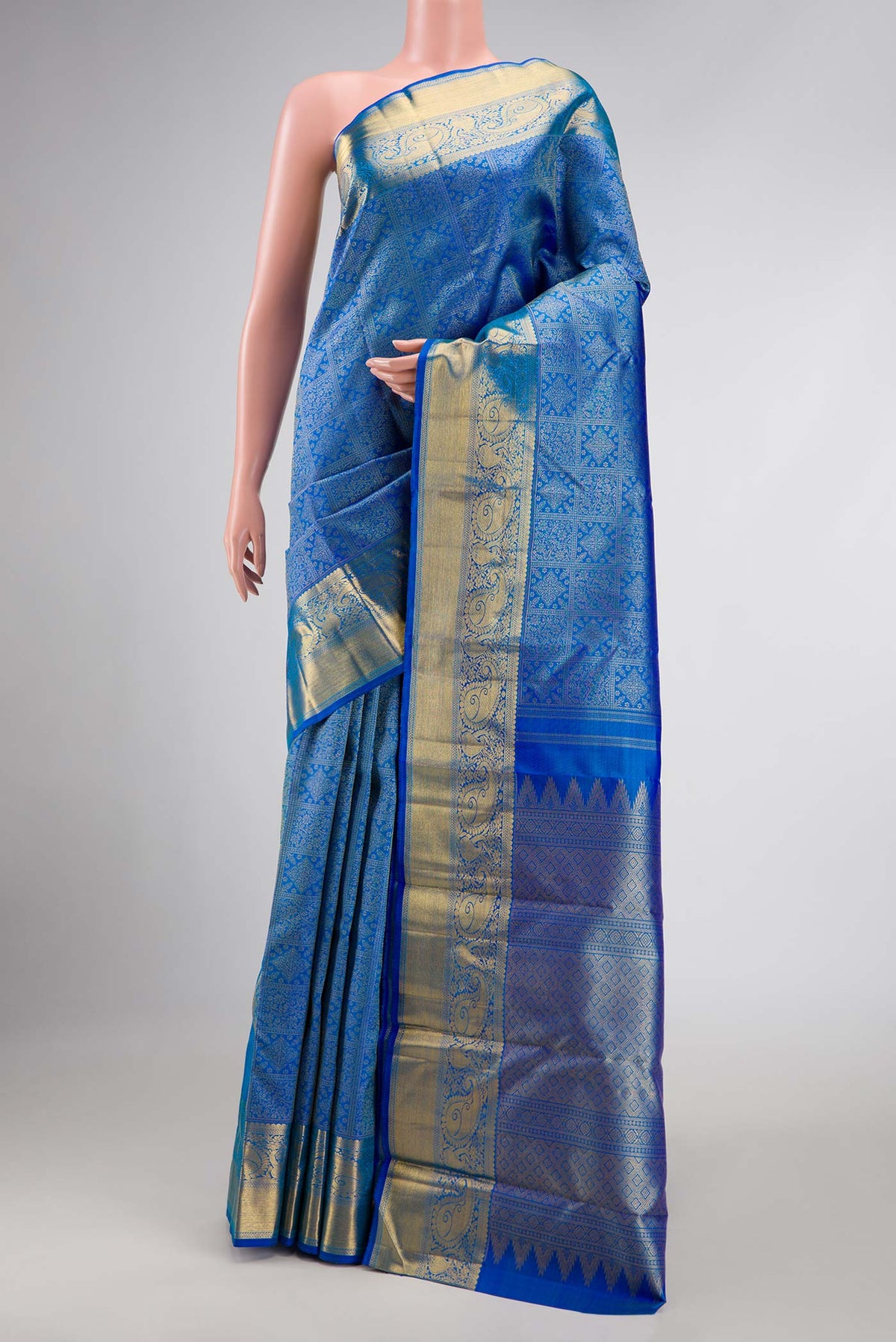 Pure Silk Pure Zari Peacock Blue Dual Tone Kanchipuram Saree with Zari Brocade on the body and Zari Border displayed on a mannequin