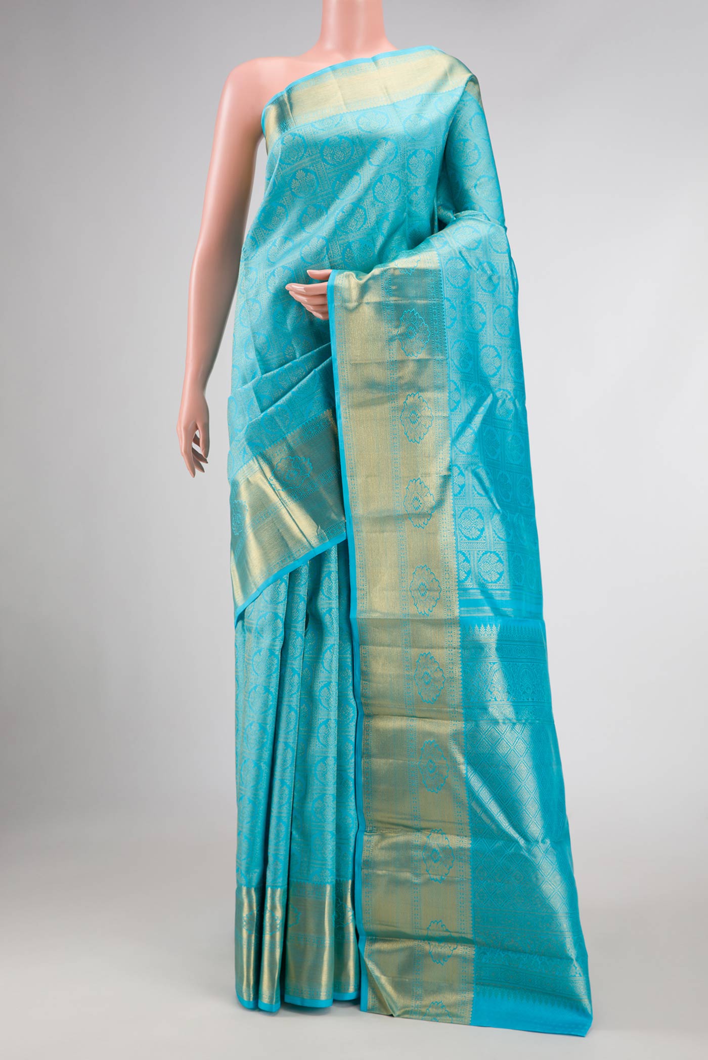Pure Silk Pure Zari Sky Blue Dual Tone Kanchipuram Saree with Zari Brocade on the body and Zari Border displayed on a mannequin
