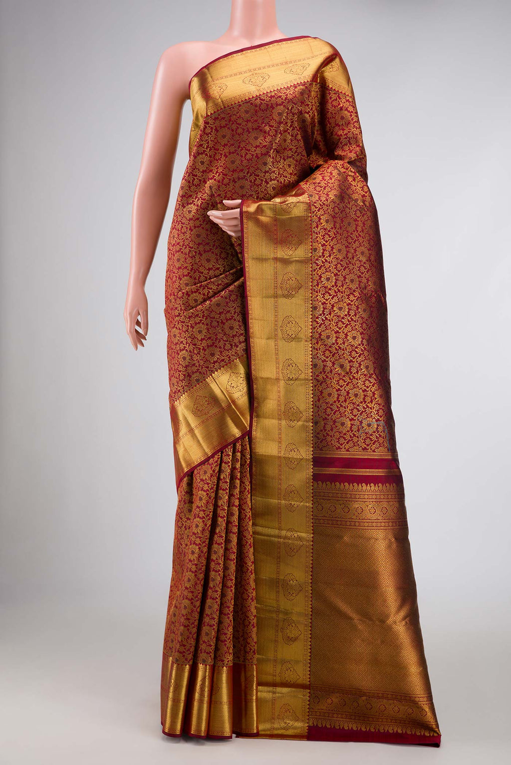 Pure Silk Pure Zari Maroon Dual Tone Kanchipuram Saree with Zari Brocade on the body and Zari Border displayed on a mannequin