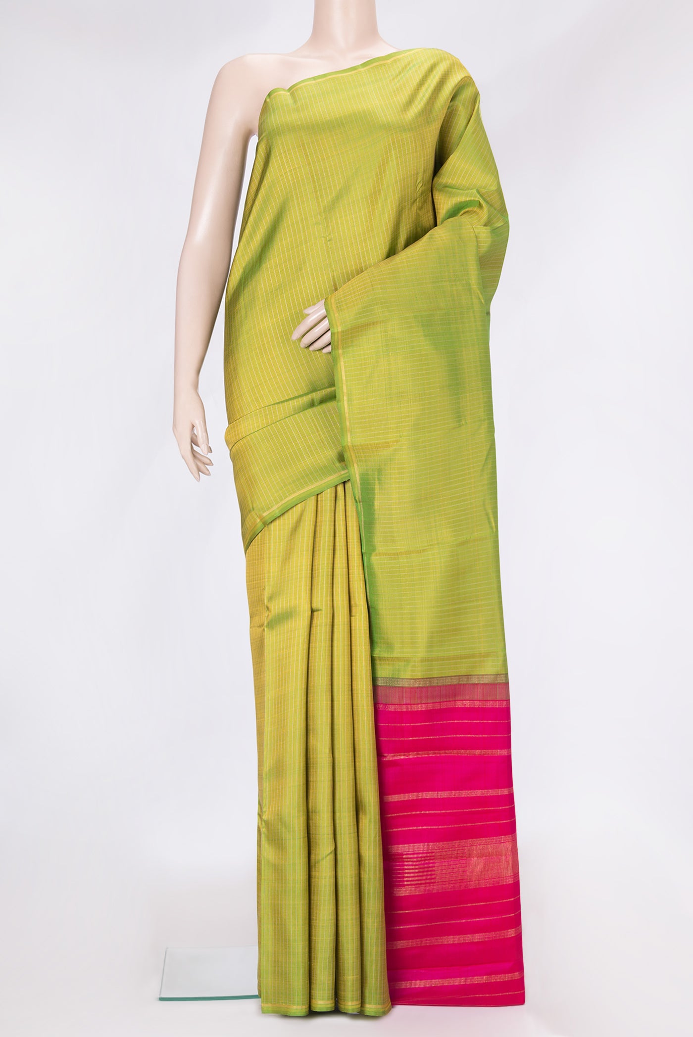 Parrot Green Dual Tone Kanjivaram Silk Saree with Stripes on the body and Thin Zari Line.  displayed on a mannequin