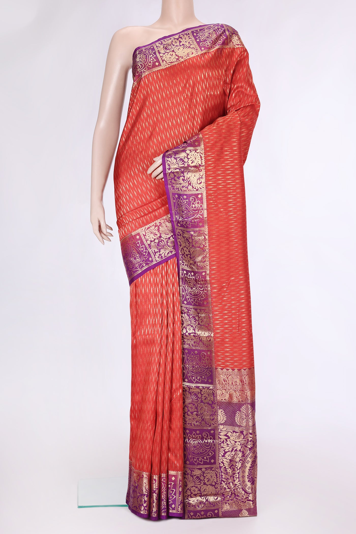 Orange Dual Tone Kanchipuram Silk Saree with Zari Butta on the body and Zari Border.  displayed on a mannequin