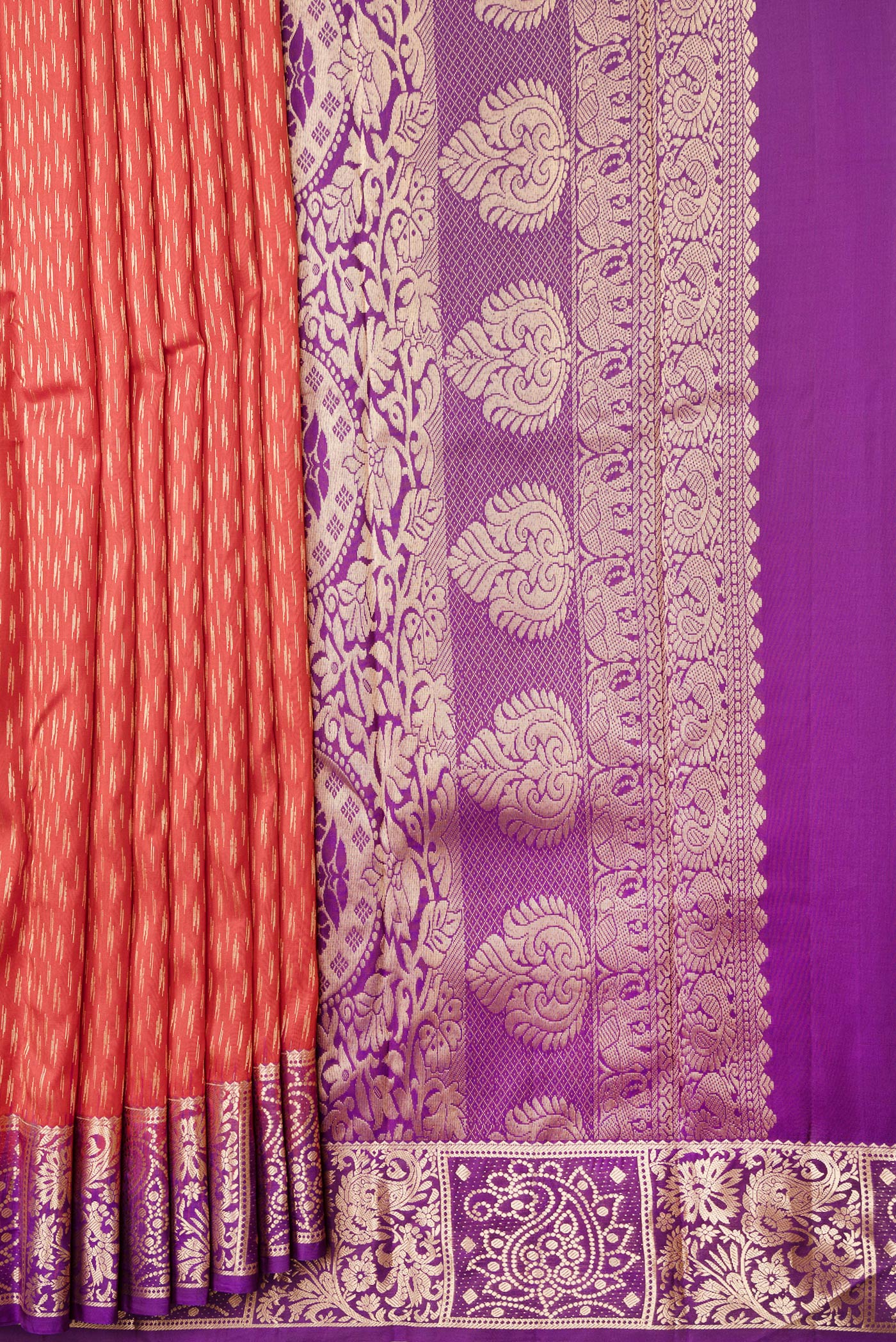Pleats and pallu of Orange Dual Tone Kanchipuram Silk Saree with Zari Butta on the body and Zari Border. 