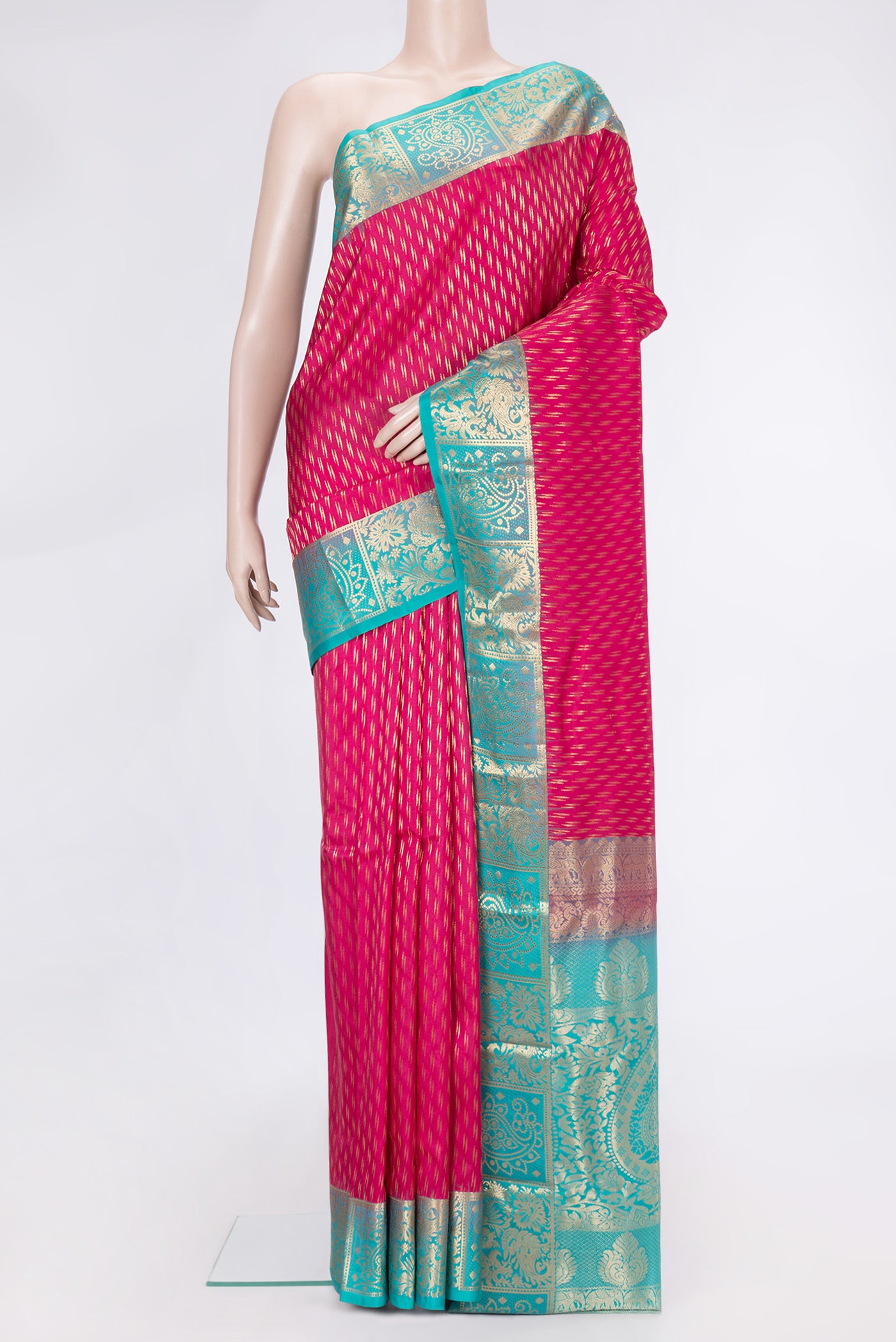 Pink Dual Tone Kanchipuram Silk Saree with Zari Butta on the body and Zari Border.  displayed on a mannequin