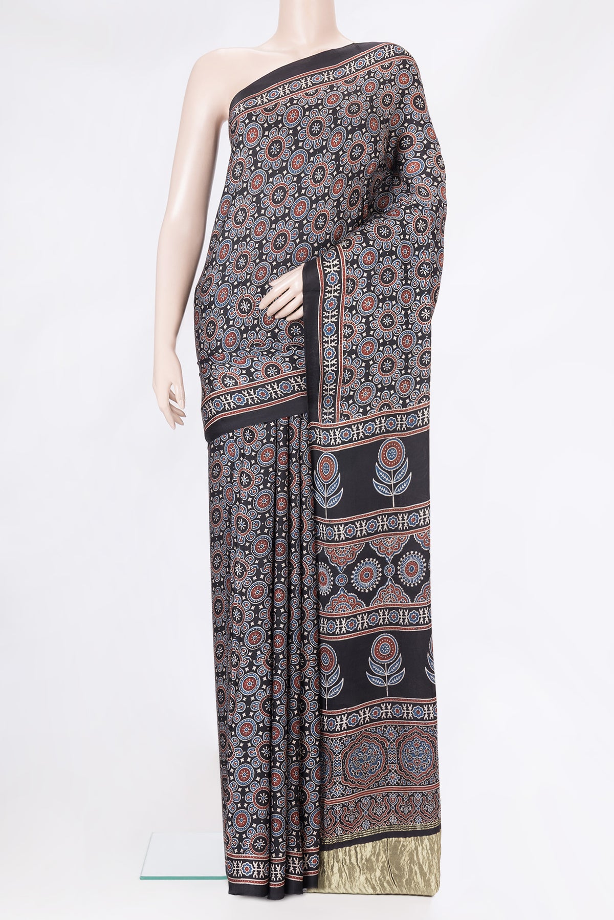 Black Dual Tone Crepe Saree with Ajrakh Print on the body and Printed Border.  displayed on a mannequin