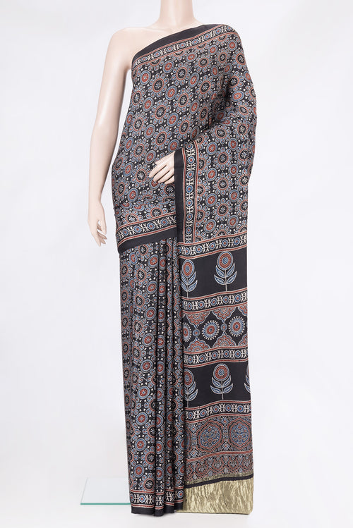 Black Dual Tone Crepe Saree with Ajrakh Print on the body and Printed Border.  displayed on a mannequin