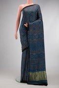 Navy Blue Dual Tone Crepe Saree with Ajrakh Print on the body and Printed Border.  displayed on a mannequin