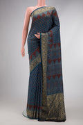 Navy Blue Dual Tone Tussar Silk Saree with Ajrakh Print on the body and Fancy Border.  displayed on a mannequin