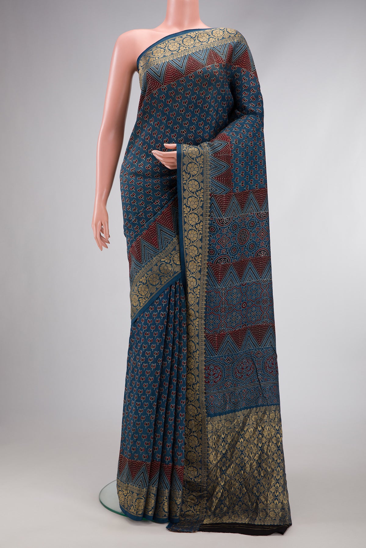 Navy Blue Dual Tone Tussar Silk Saree with Ajrakh Print on the body and Fancy Border.  displayed on a mannequin