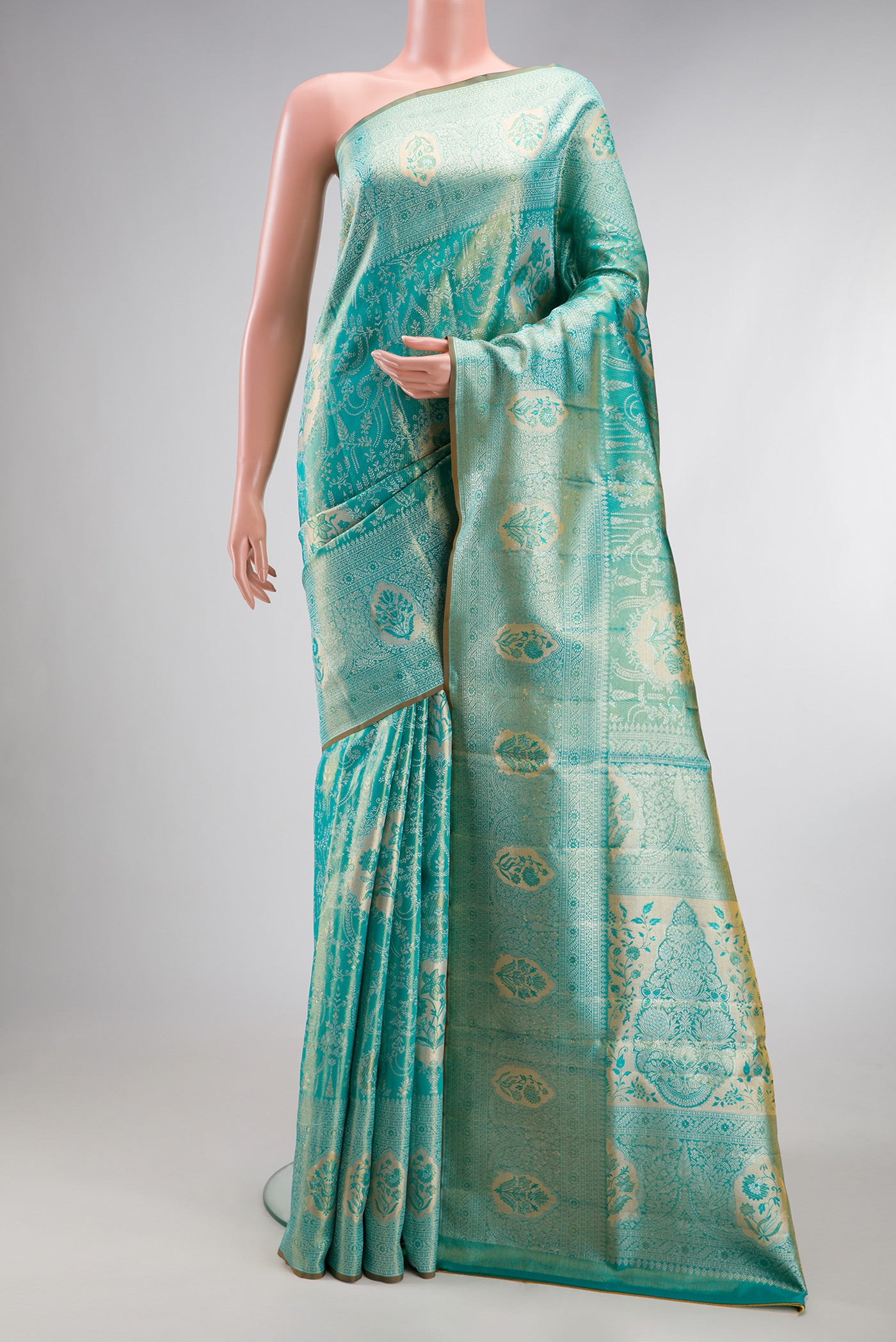 Turquoise Dual Tone Kanchipuram Tissue Silk Saree with Zari Brocade on the body and Zari Border.  displayed on a mannequin