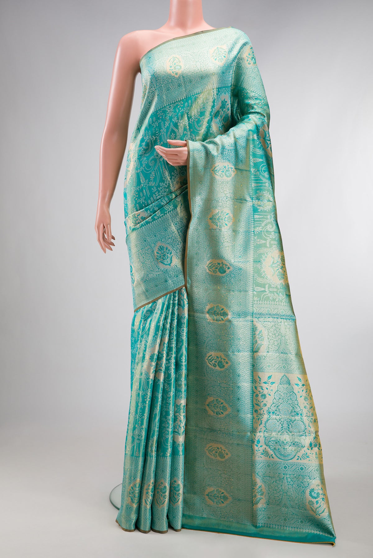 Turquoise Dual Tone Kanchipuram Tissue Silk Saree with Zari Brocade on the body and Zari Border.  displayed on a mannequin