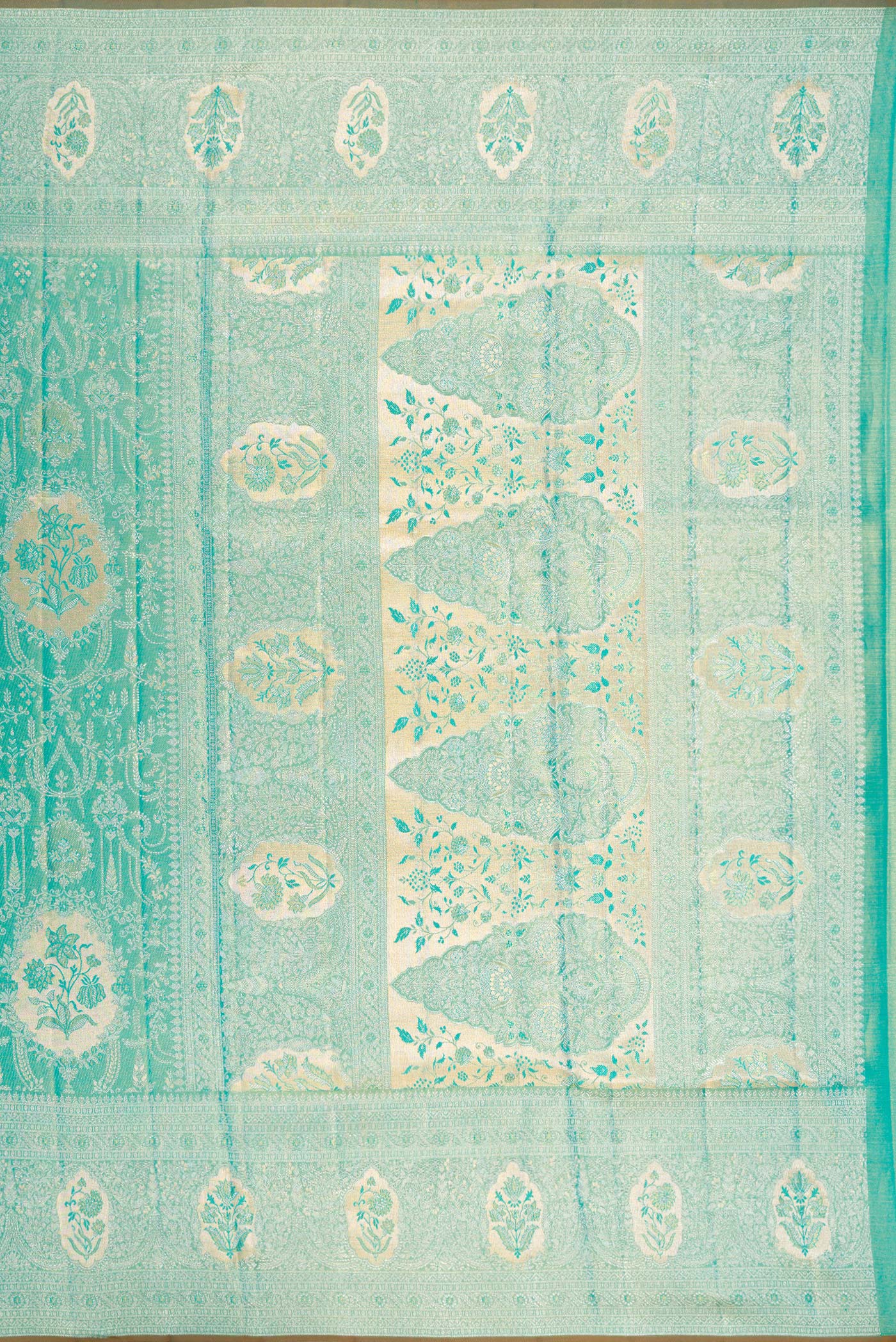 Close up image of the pallu of Turquoise Dual Tone Kanchipuram Tissue Silk Saree with Zari Brocade on the body and Zari Border. 
