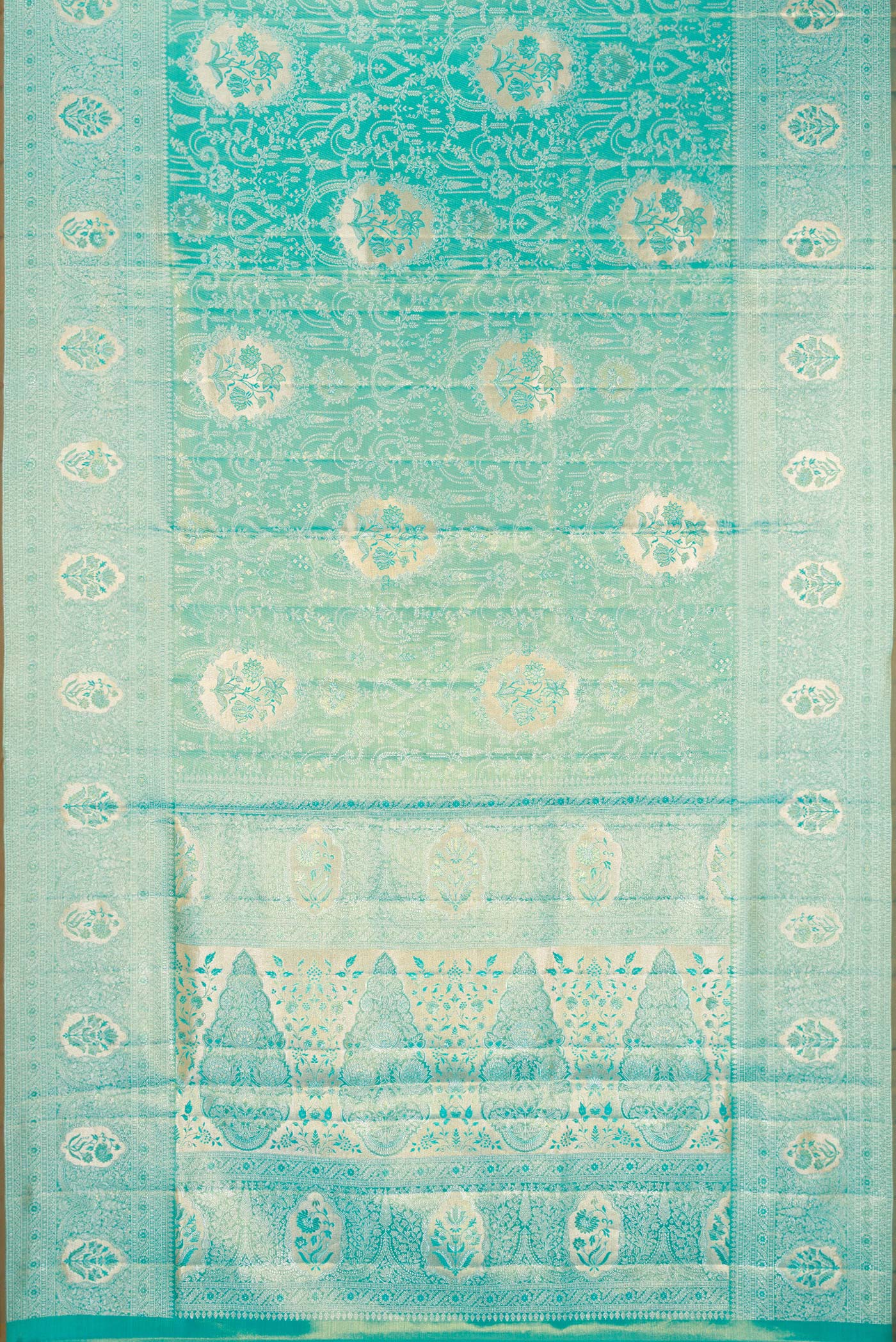 Flat view of Turquoise Dual Tone Kanchipuram Tissue Silk Saree with Zari Brocade on the body and Zari Border. 