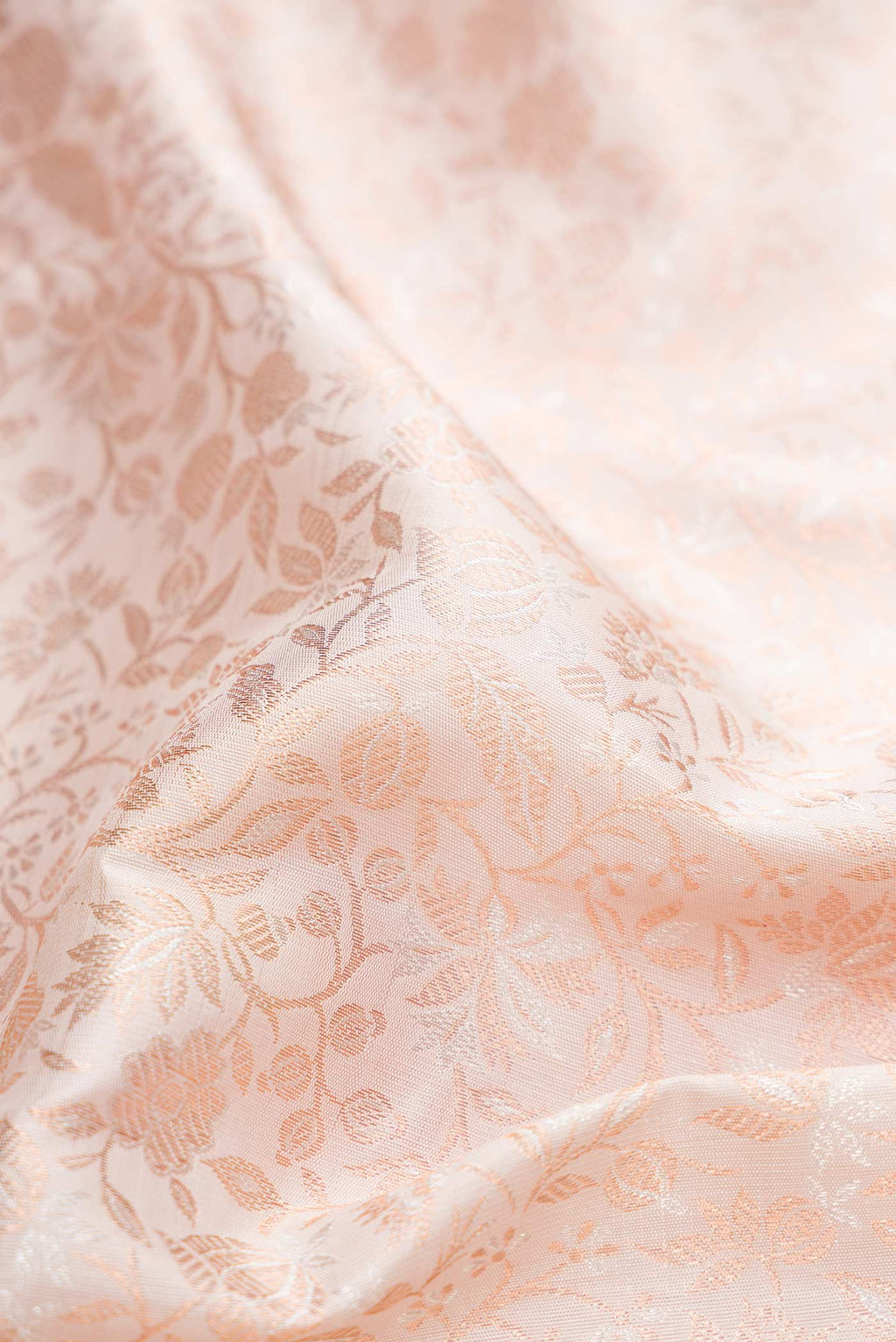 Close up of Pure Silk Pure Zari Rose pink Kanchipuram Saree with Zari Brocade on the body and Zari Border displaying folds