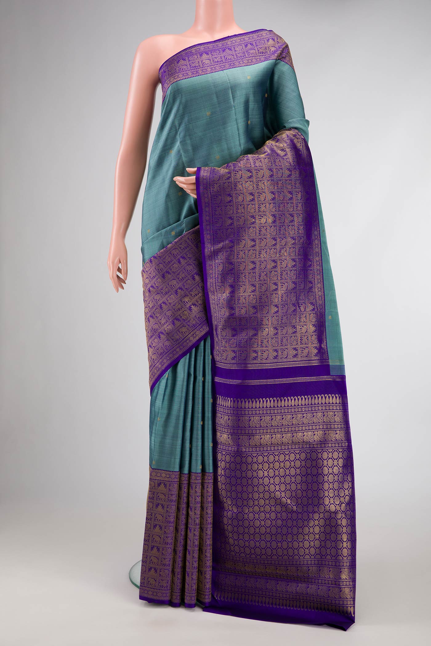 Pure Silk Pure Zari Maya Blue Dual Tone Kanjivaram Saree with Zari Butta on the body and Fancy Border.  displayed on a mannequin