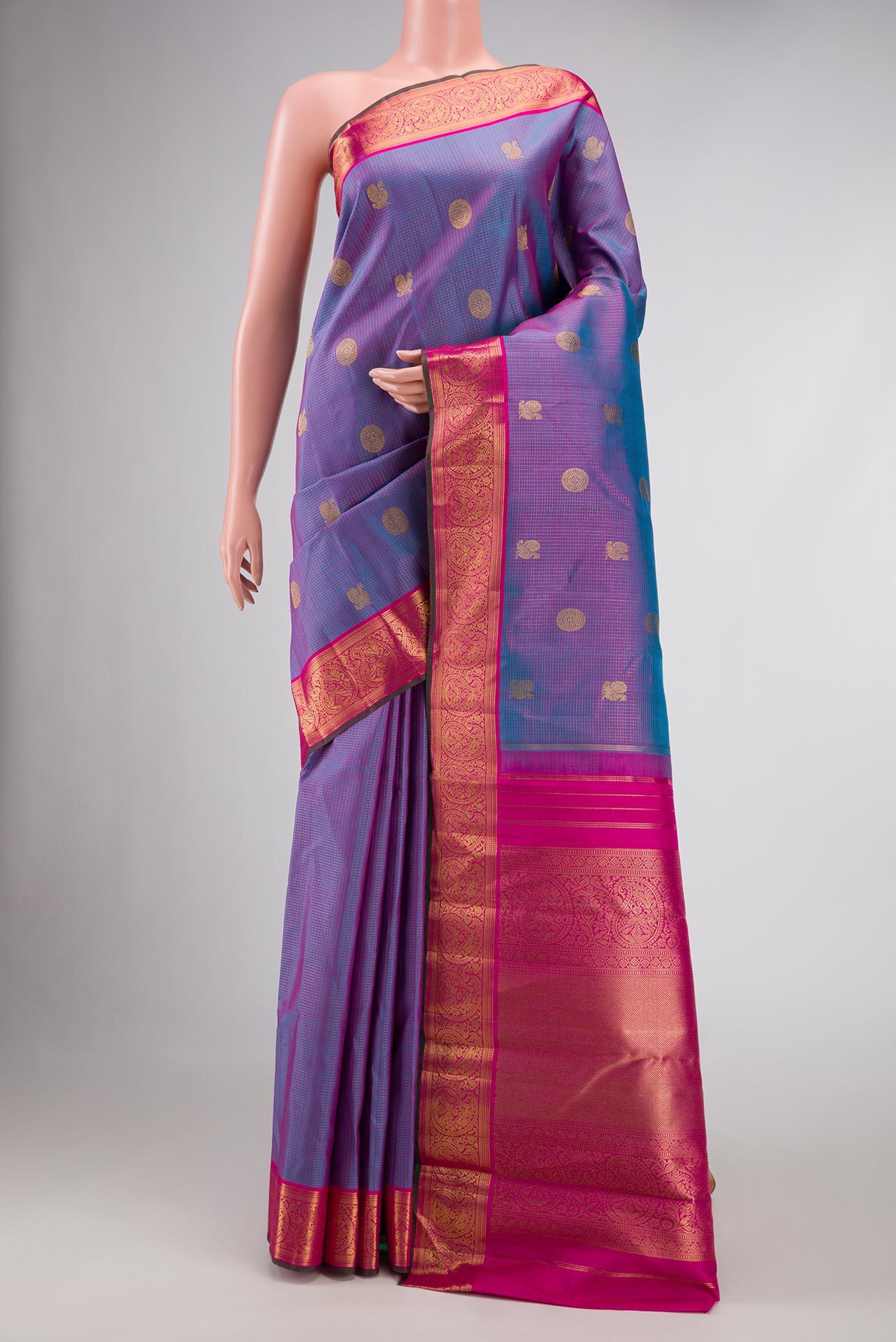 Pure Silk Pure Zari Lavender Dual Tone Kanjivaram Saree with Zari Butta on the body and Zari Border.  displayed on a mannequin