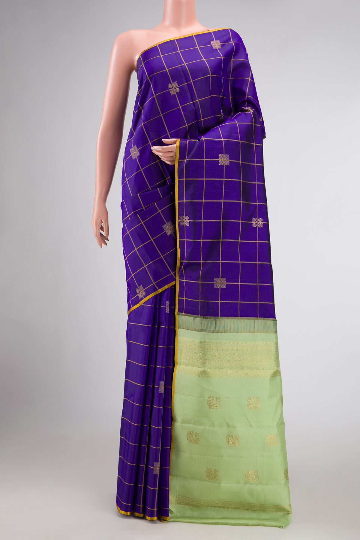 Royal Blue Dual Tone Kanchipuram Silk Saree with Checked design on the body and Thin Zari Line displayed on a mannequin
