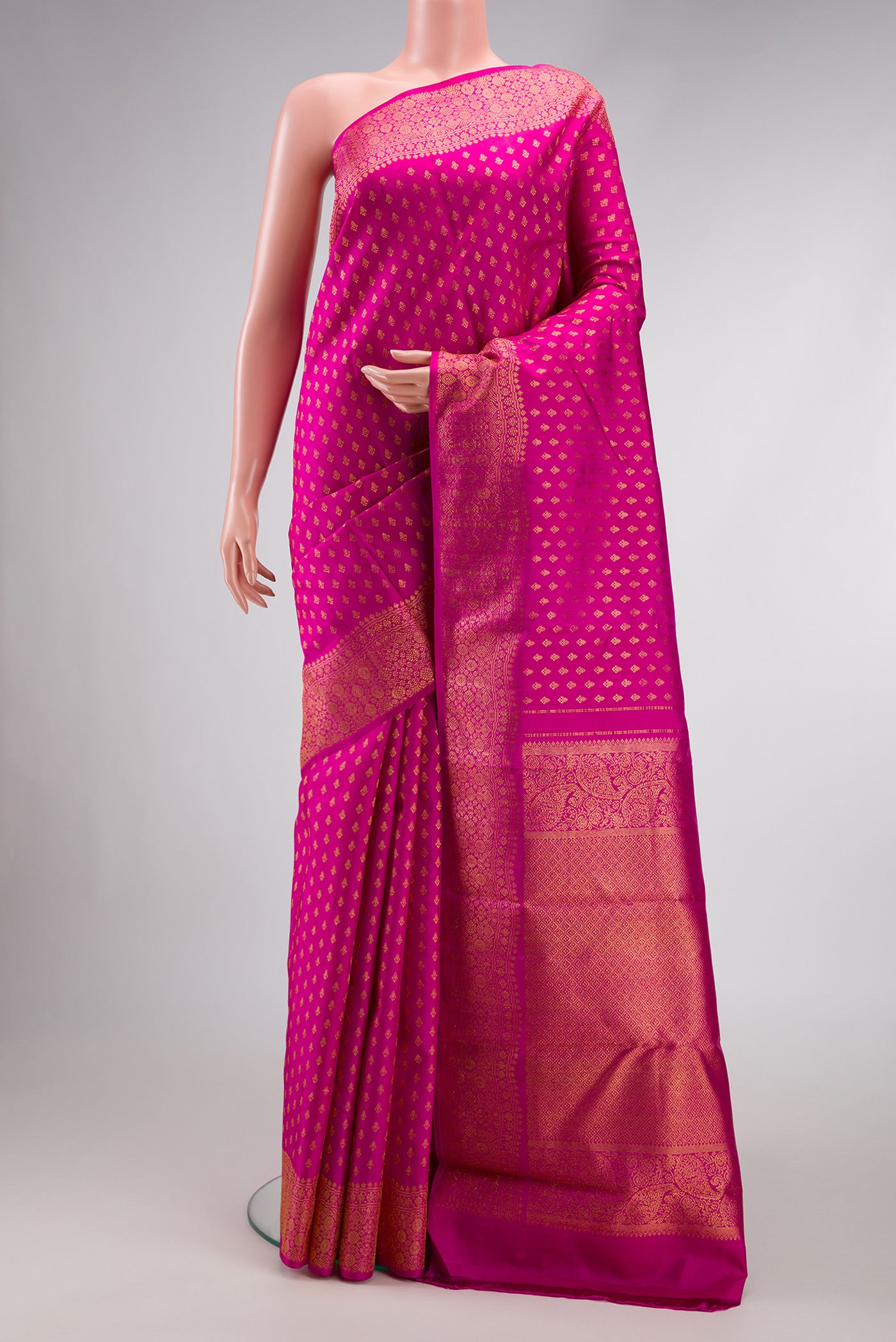 Pure Silk Pure Zari Pink Dual Tone Kanjivaram Saree with Zari Butta on the body and Zari Border.  displayed on a mannequin