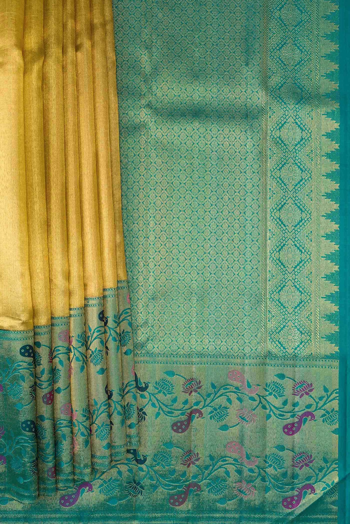 Pleats and pallu of Gold Dual Tone Kanjivaram Tissue Silk Saree with Zari Brocade on the body and Zari And Thread Border. 