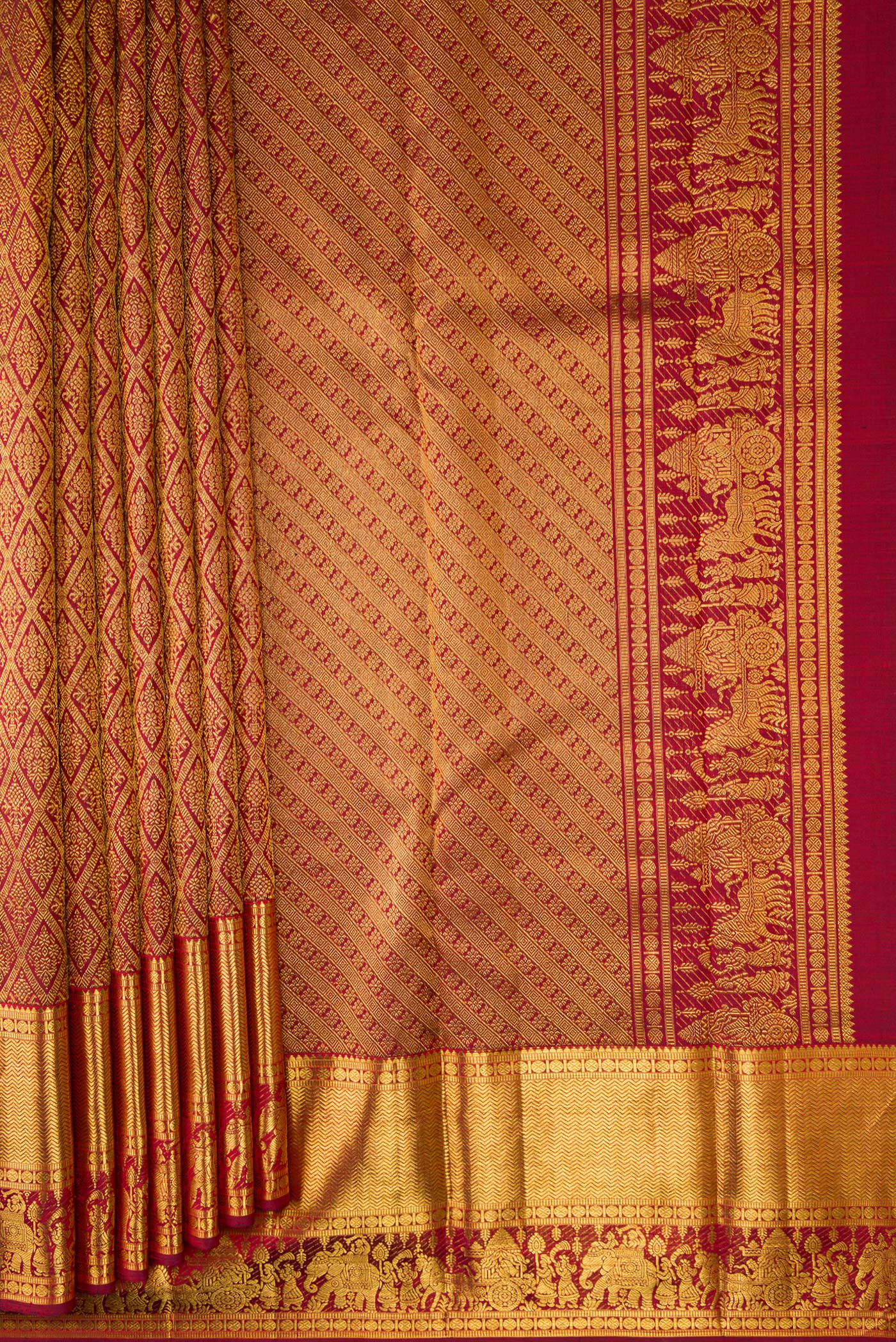 Pleats and pallu of Maroon Dual Tone Kanchipuram Silk Saree with Zari Brocade on the body and Zari Border. 