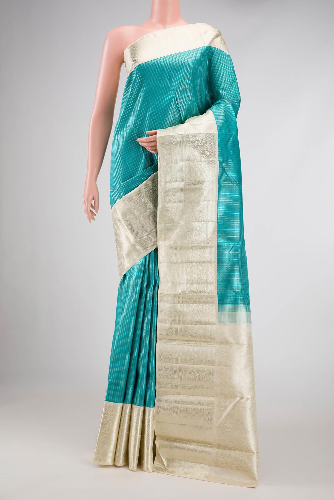 Sky Blue Dual Tone Kanchipuram Silk Saree with Zari Brocade on the body and Zari Border.  displayed on a mannequin